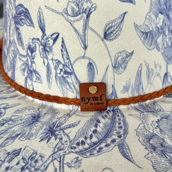 611fc05e3c4ce80992caae23_blue-chinoiserie-ivory-teardrop-rancher-back-detail_1776441955068.jpg