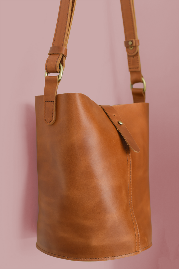 611fc05e3c4ce80992caae23_bucket-bag-brown-side_1785429982657.png