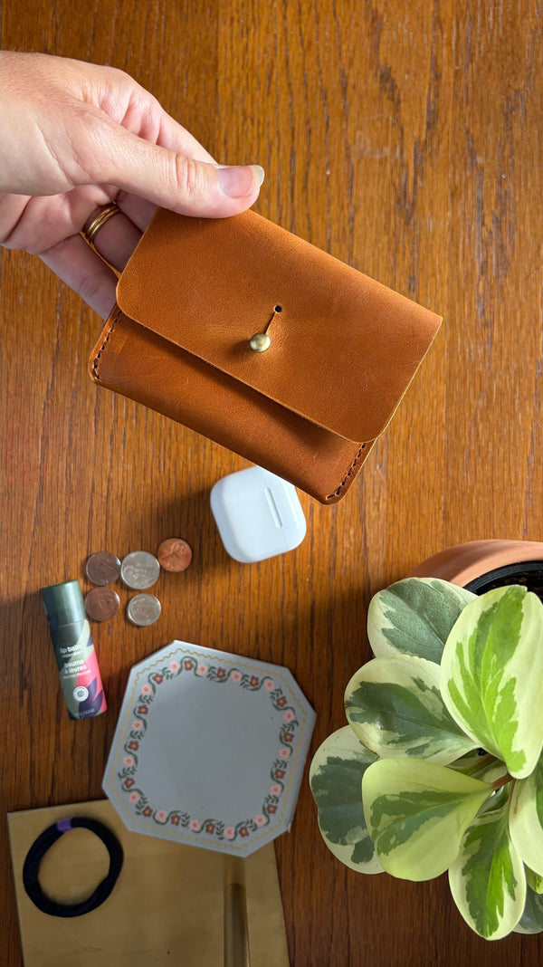 611fc05e3c4ce80992caae23_card-carrier-brown-desk_1785430944253.png