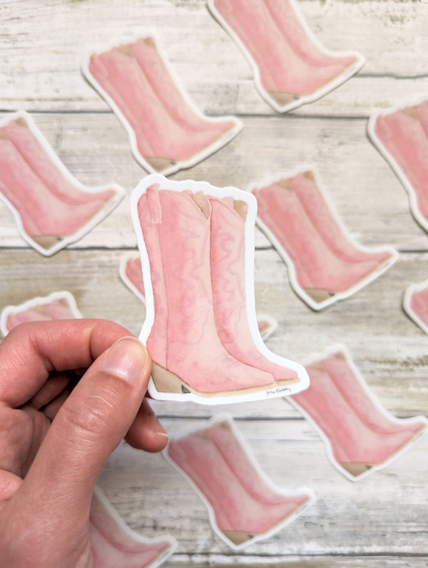 611fc05e3c4ce80992caae23_pink-boots-holding-sticker_1753884454301.jpg