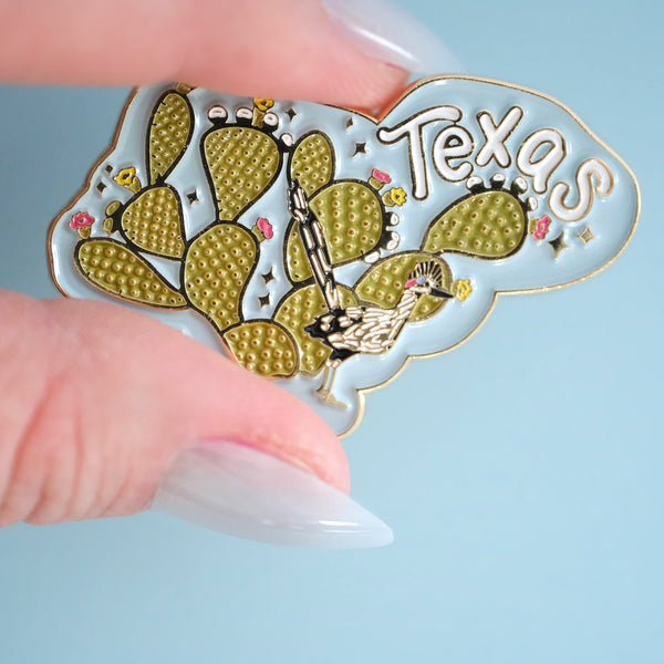 611fc05e3c4ce80992caae23_prickly-pear-and-road-runner-texas-pin_1790870304169.jpg
