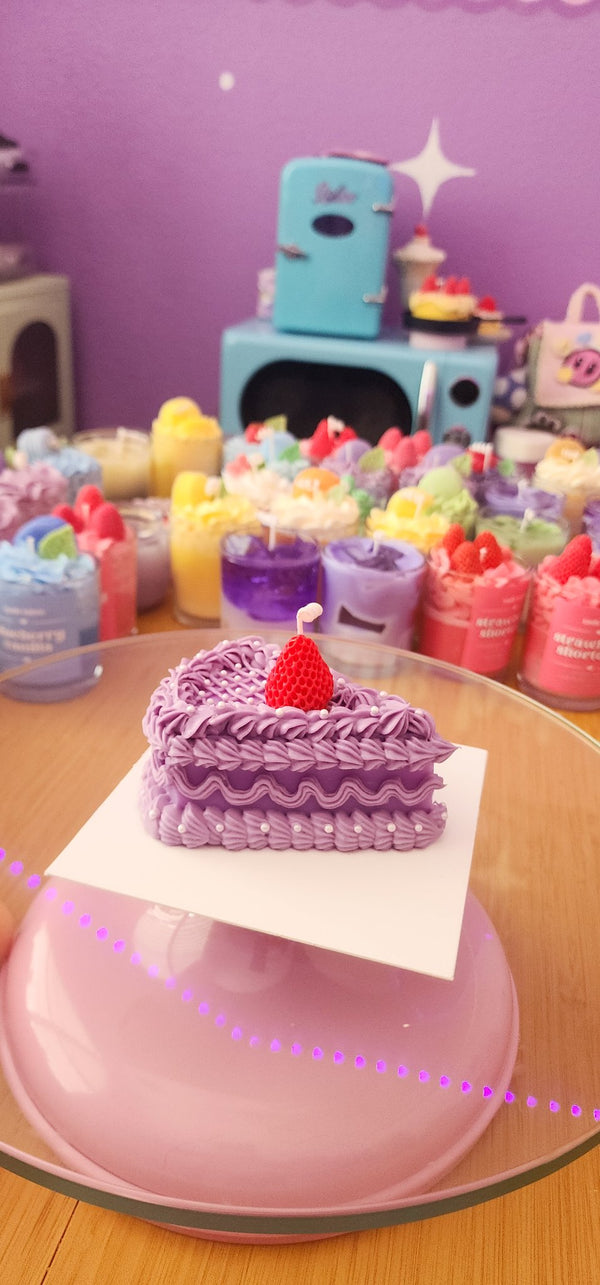 611fc05e3c4ce80992caae23_purple-cake-slice-candle3_1783730513622.jpg