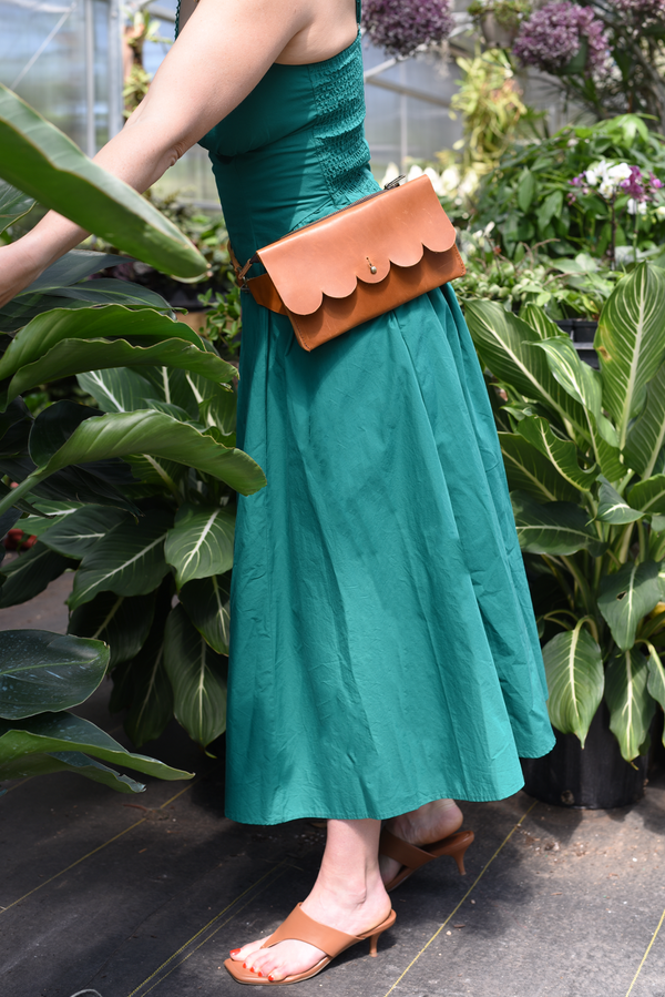 611fc05e3c4ce80992caae23_scallop-sling-bag-brown-belt_1785430390044.png